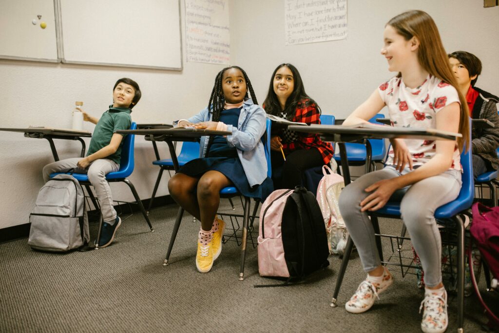 A diverse group of students attentively participating in a classroom setting.